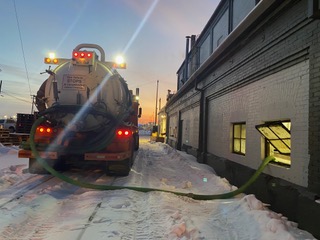 Vacuum truck from Recycle West handles contaminated slurry and oily water transportation in Alberta